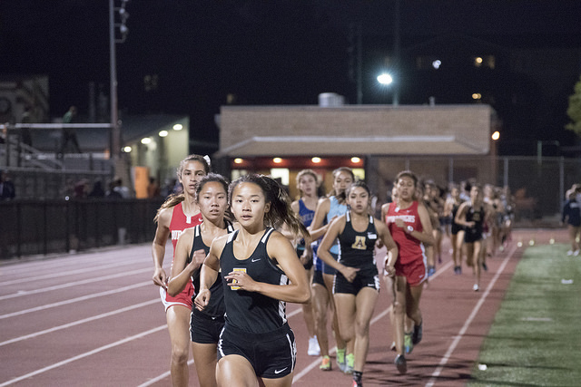 Junior Jasmine He as the front runner in this track event.