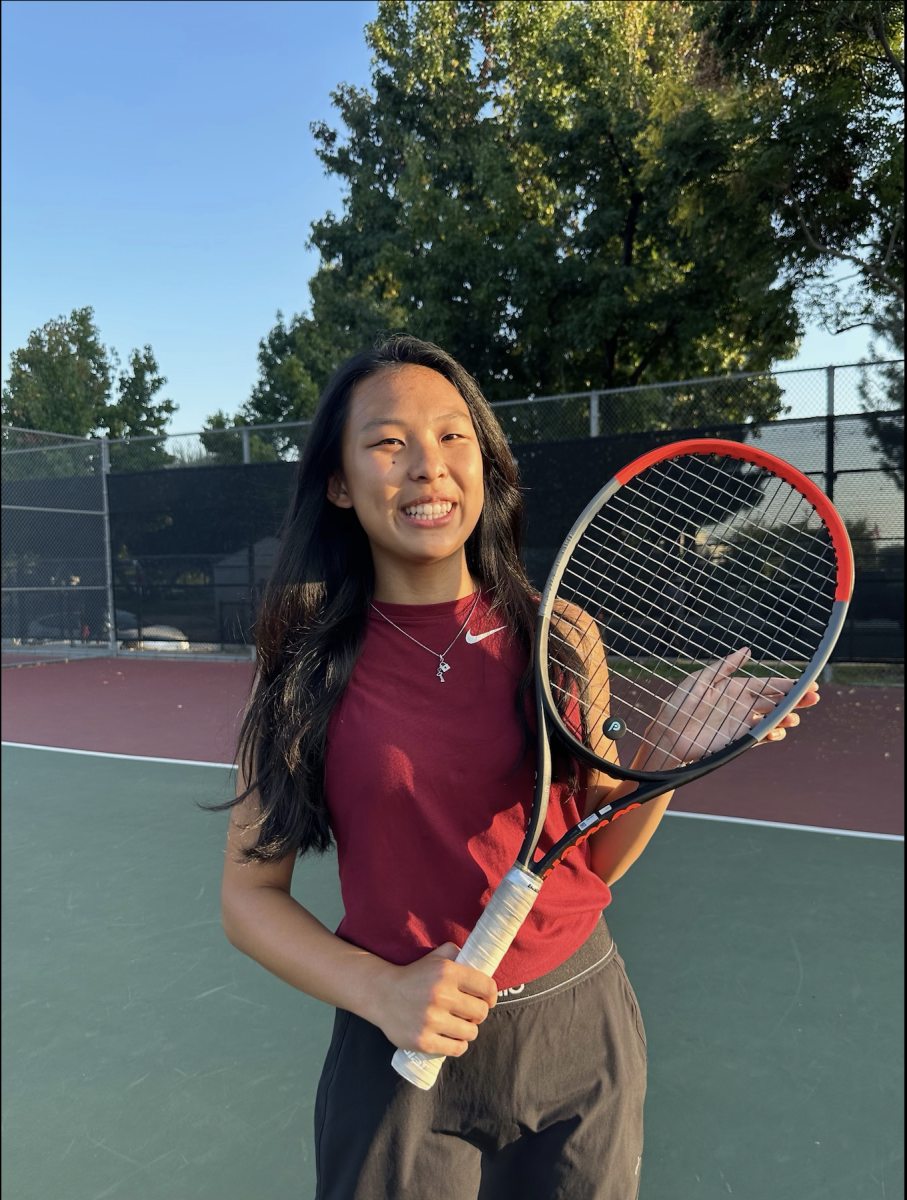 Varsity athlete star Annika Chan posing with her racket!