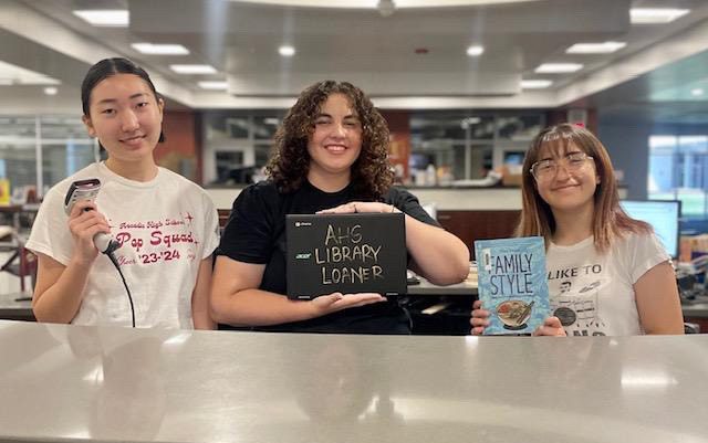 AHS Library Aides ready to check out books