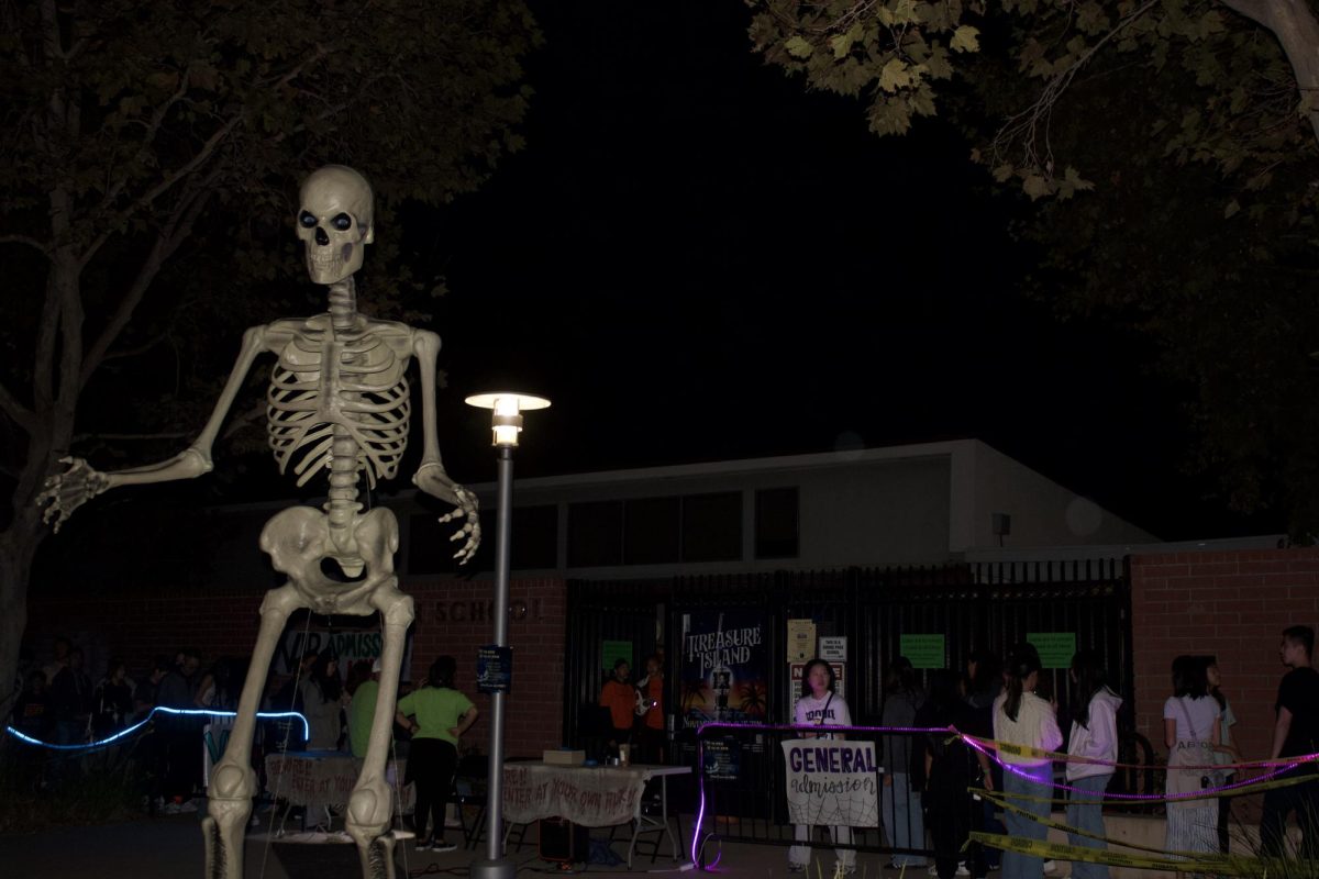 Students form a long line outside of AHS, waiting for their turn to walk through the Haunted House.