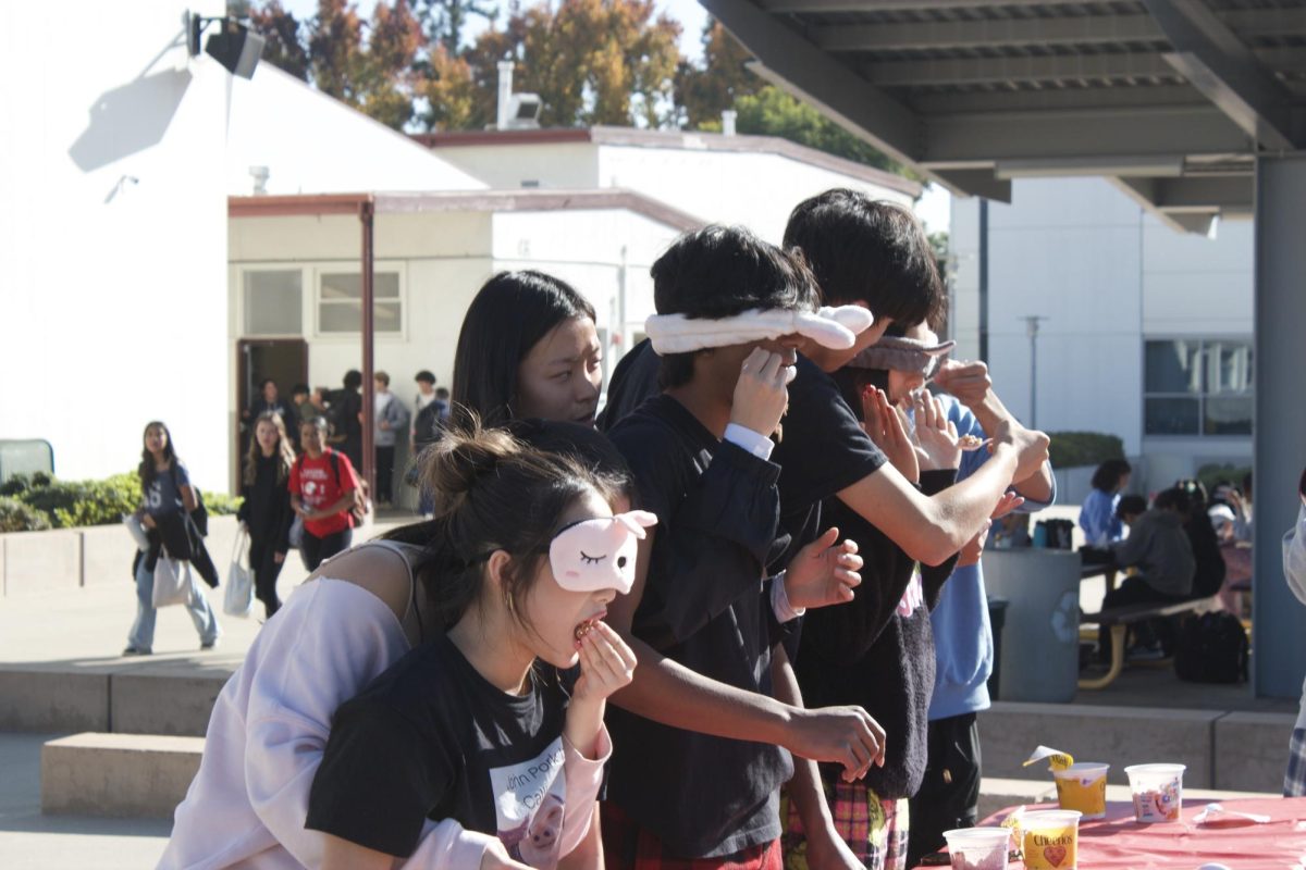 Students participating in the cereal-eating competition on Polar Express Monday