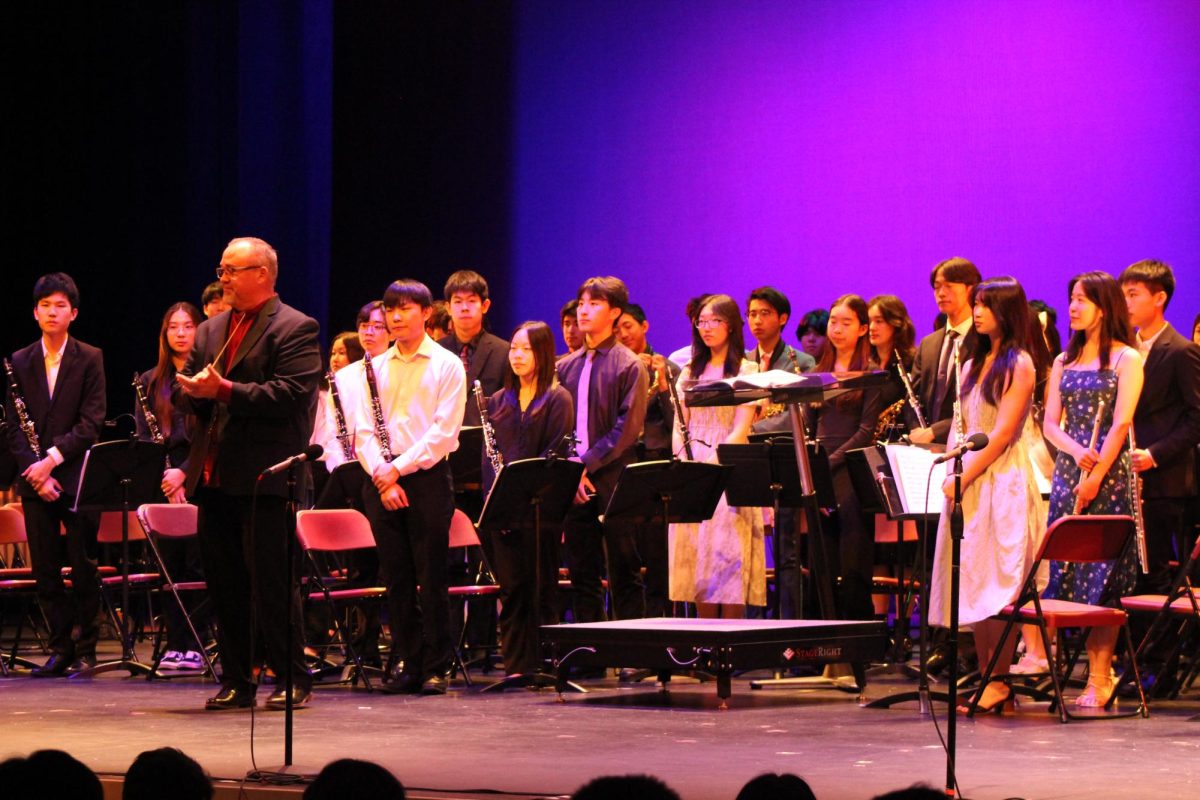 Brief: Chanteurs, Orchestra, and Wind Ensemble Take the Stage at the POPS Assembly